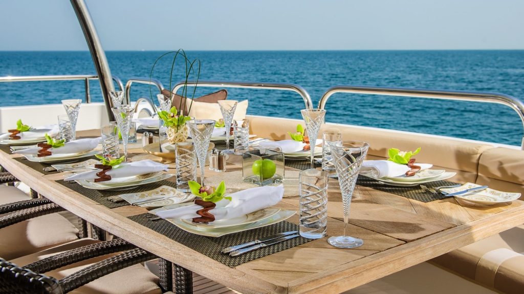 Table set for dinner on a yacht | Is A Career In Yachting Industry Good For Me