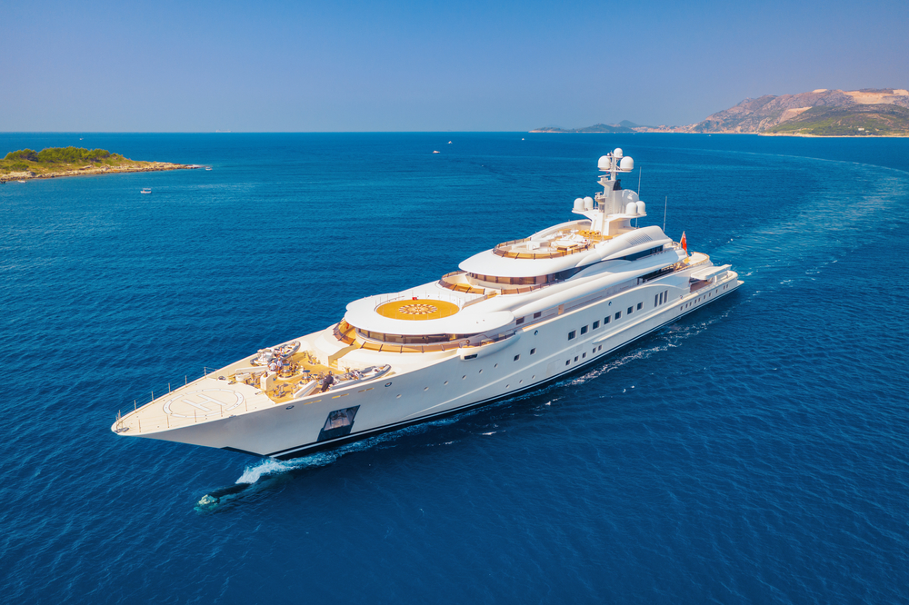 Image of a large yacht in the sea | What certificates do I need to work on board a yacht?