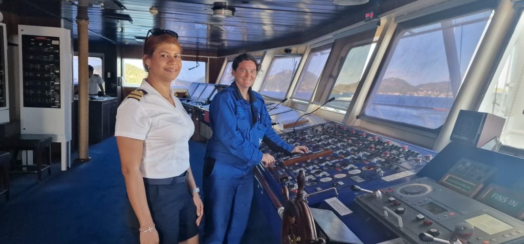 Image of two female Windstar Crew members, stood on the bridge of the ship | International Seafarers' Employment and Payroll