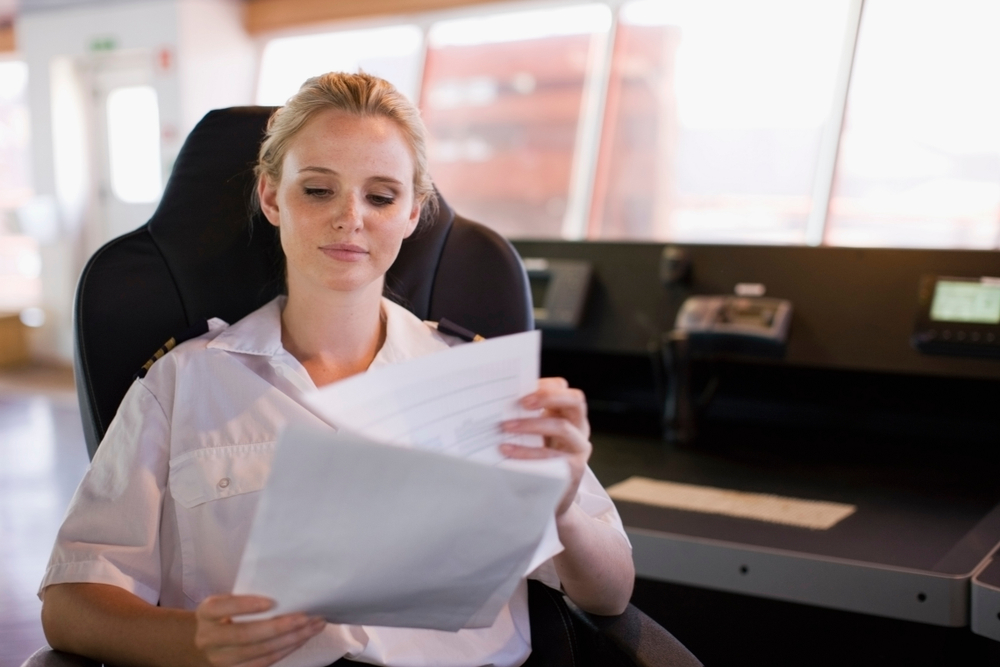 Female Captain checking references for crew | CrewPass 