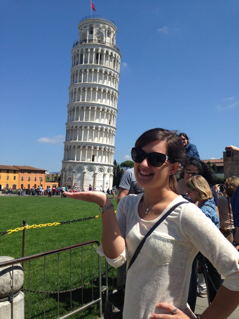 Heather pictured holding the Leaning Tower of Pisa